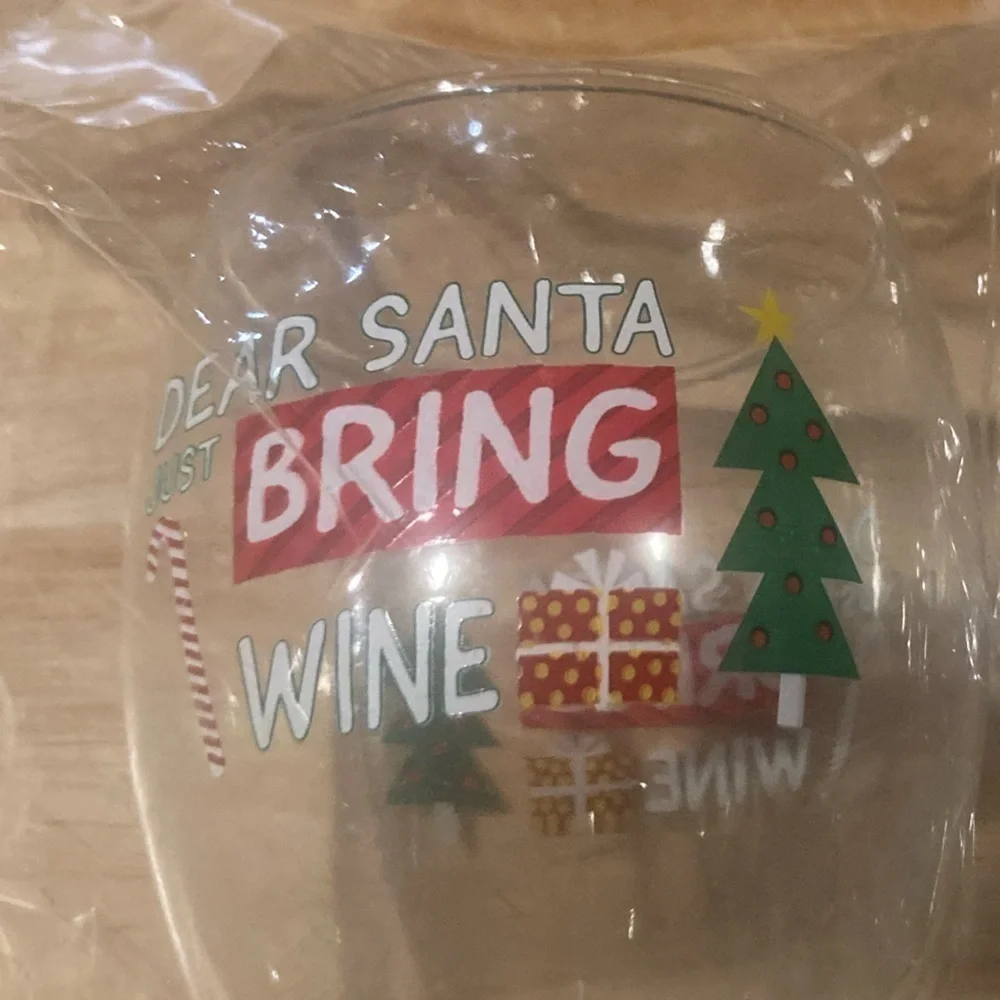 4/$25 Christmas wine glasses that say Dear Santa bring wine. Never used